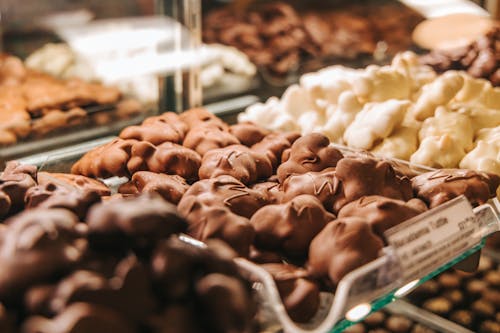 Free Milk Chocolates and White Chocolates on Display Stock Photo