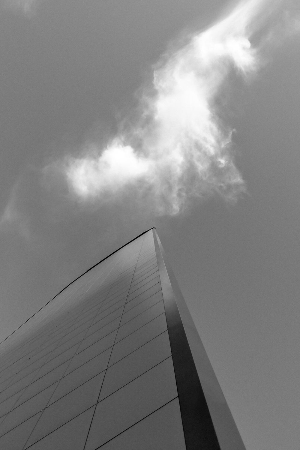 Grayscale Photo of a Skyscraper near the Clouds · Free Stock Photo