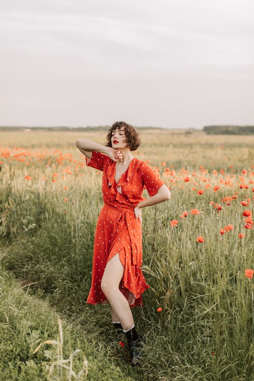 A Woman Posing in the Flower Field 