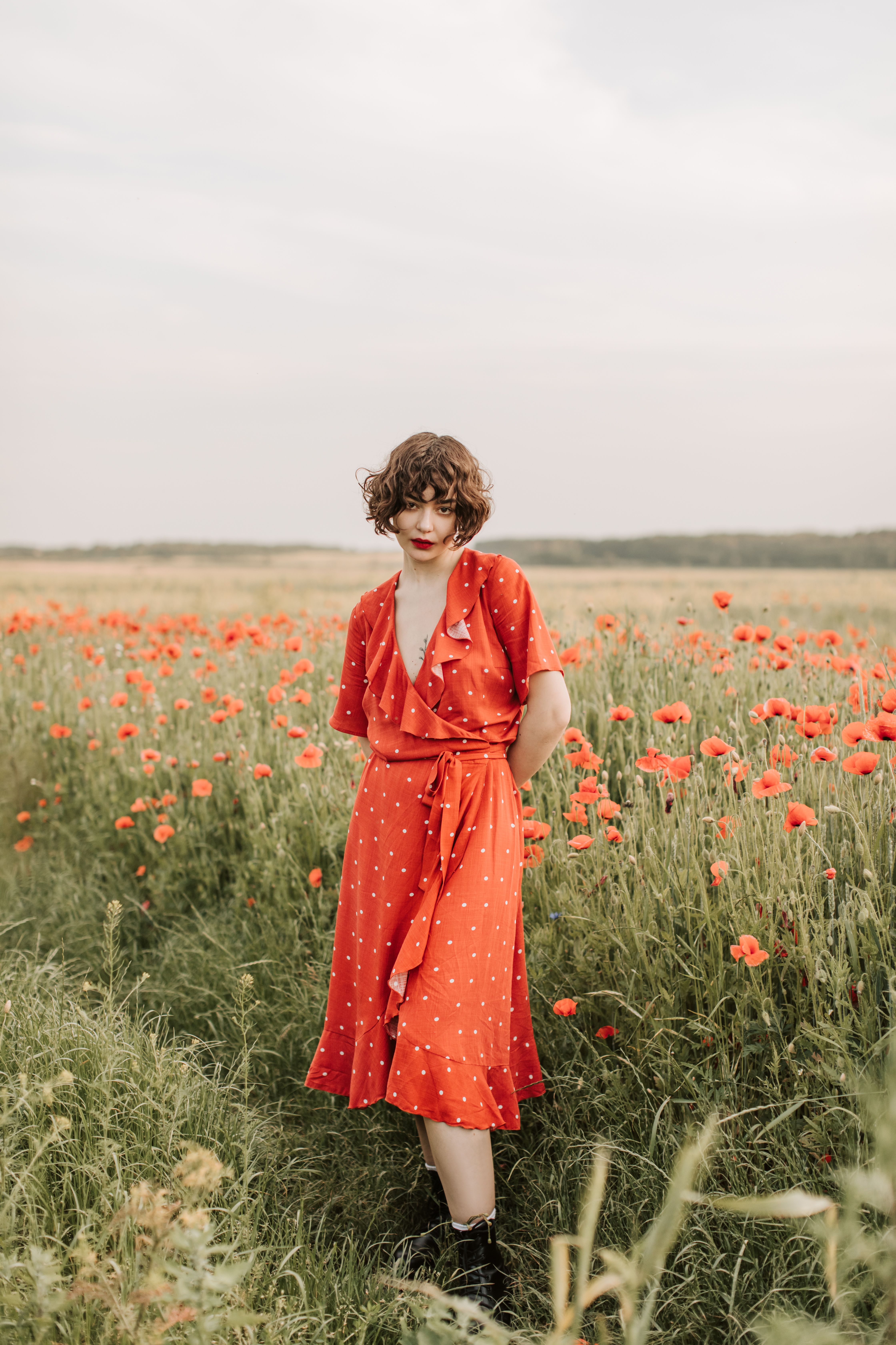 A Woman in Red Dress with Curly Hair · Free Stock Photo