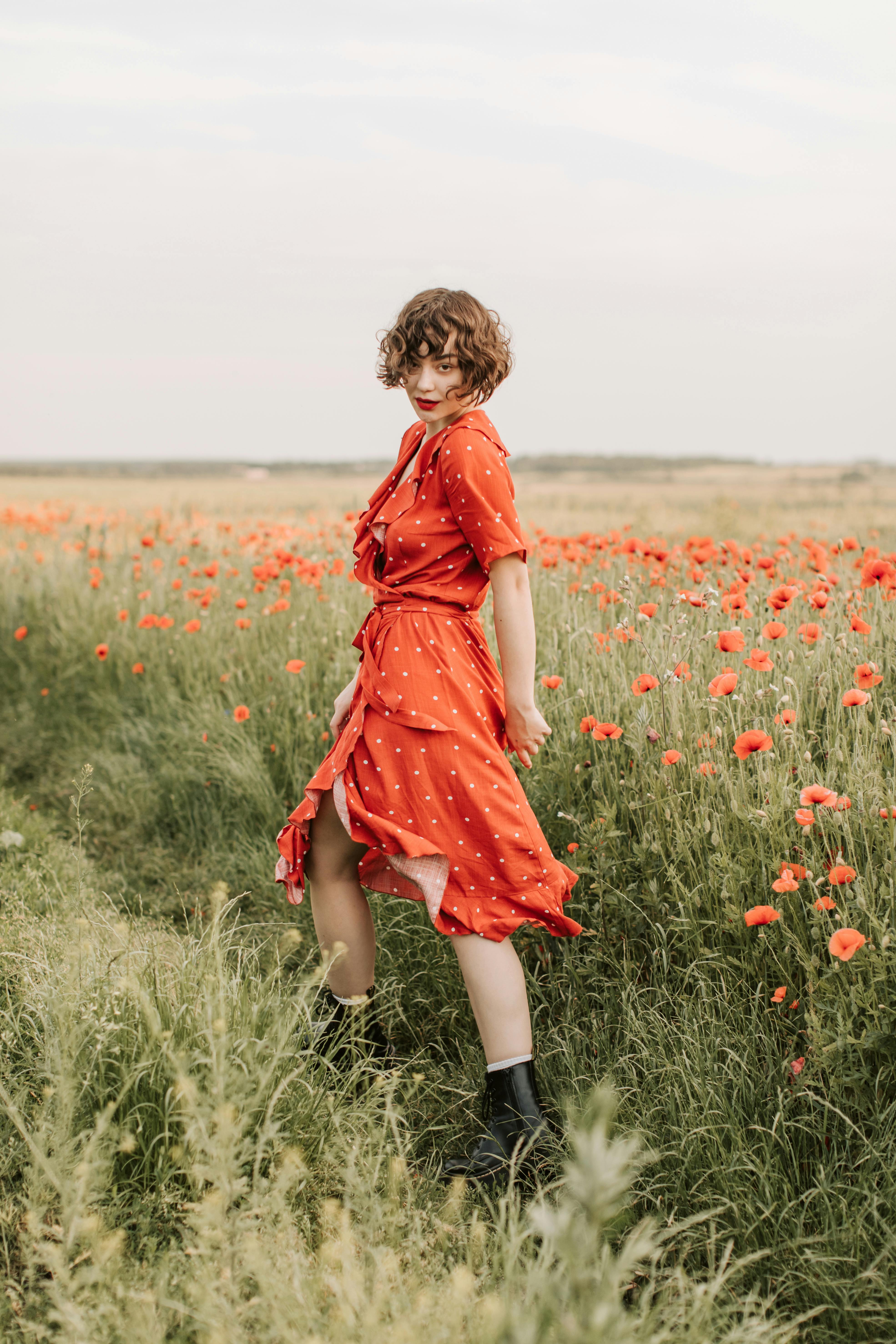 Portrait of a Woman Wearing Red Lipstick and Dress in Poppy Meadow ...