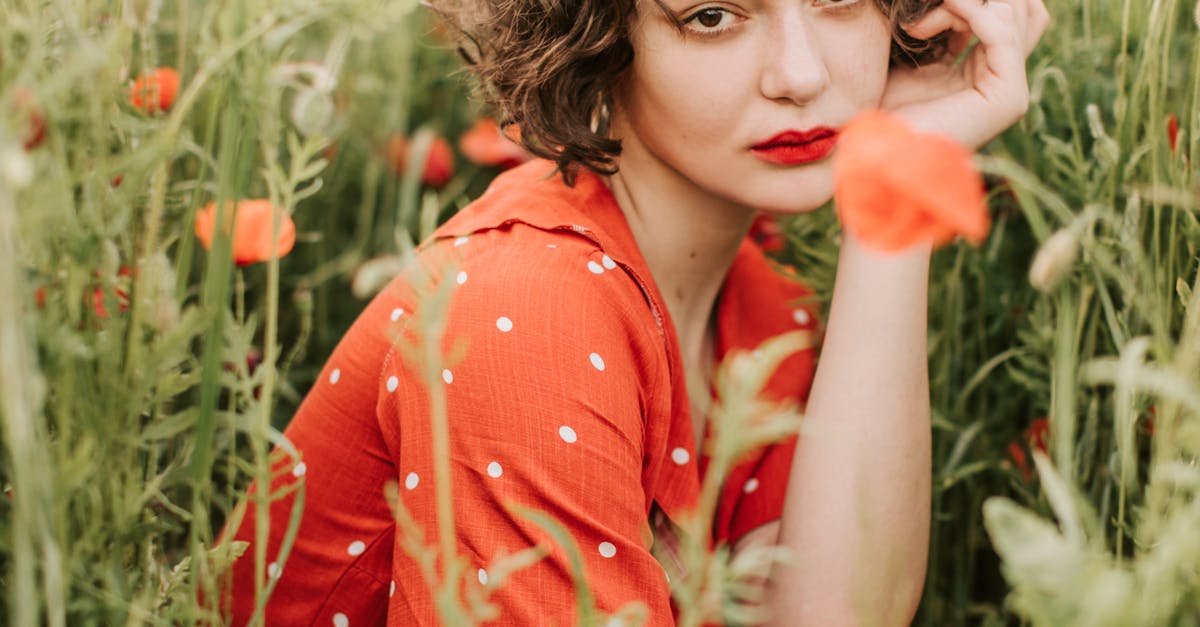 Beautiful Woman in Red Lipstick Posing at The Camera · Free Stock Photo