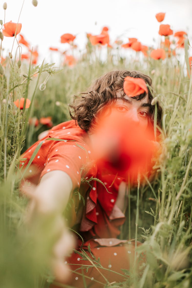 Selective Focus Shot Of A Woman Reaching At The Camera