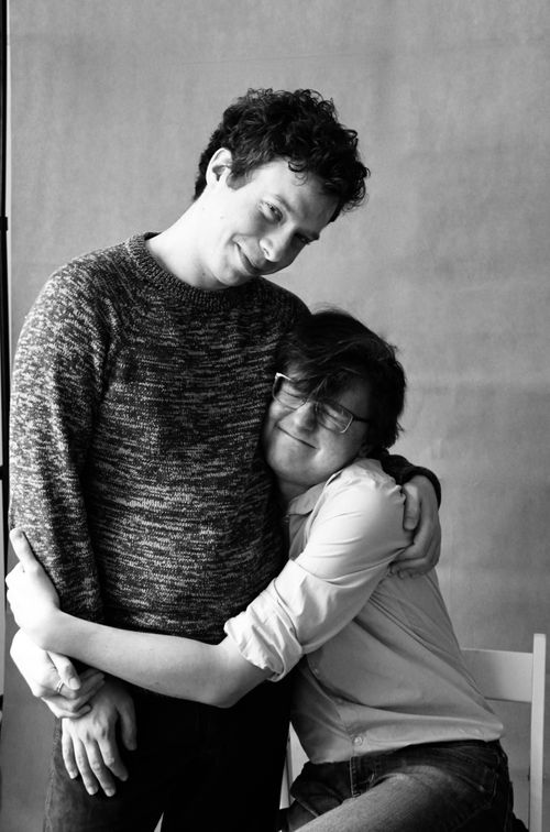 Free A joyful couple embracing warmly, showcasing love and connection in a black and white portrait. Stock Photo