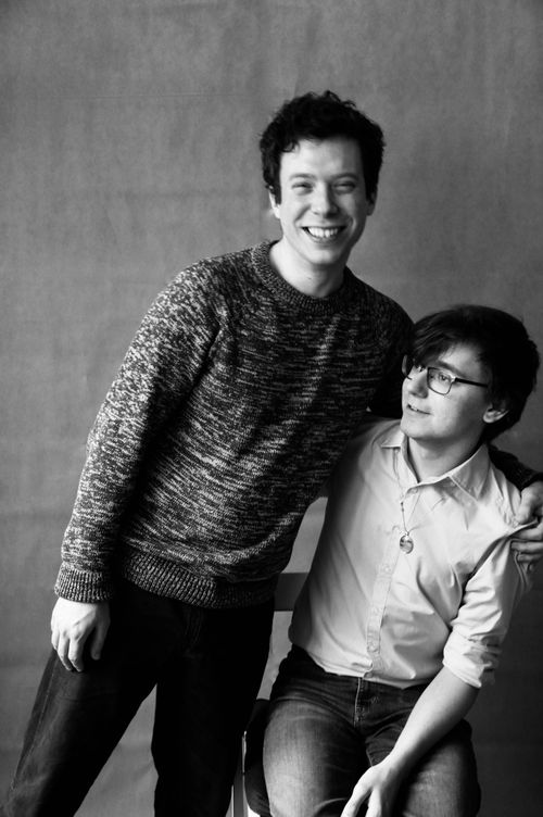 Free Smiling friends captured in a candid black and white portrait. Stock Photo