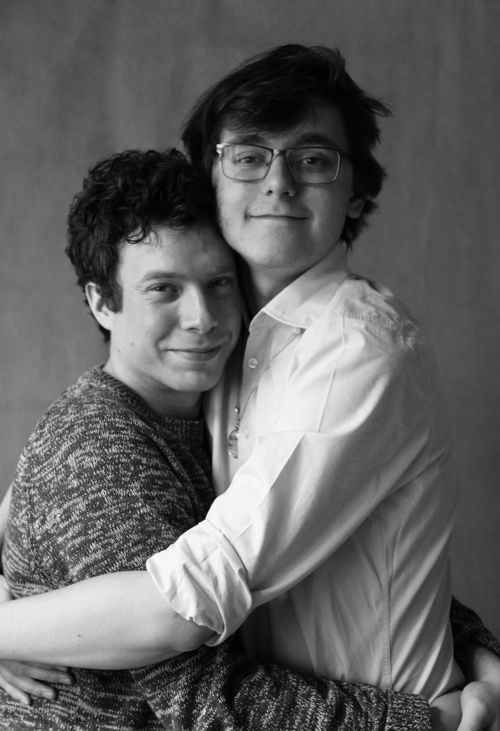 Free Black and white portrait of a loving couple embracing, showcasing affection and happiness. Stock Photo