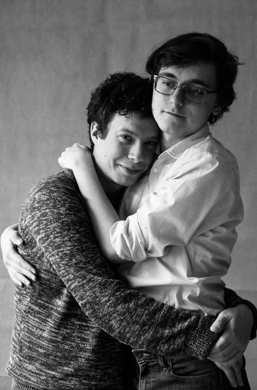 Free Black and white portrait of a loving same-sex couple embracing with smiles. Stock Photo