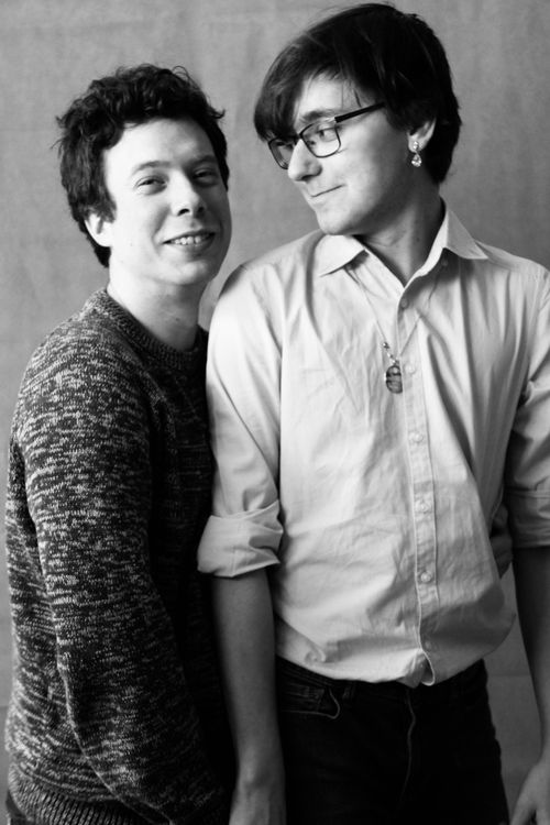 Free Charming black and white photograph of two happy men in a studio setting. Stock Photo