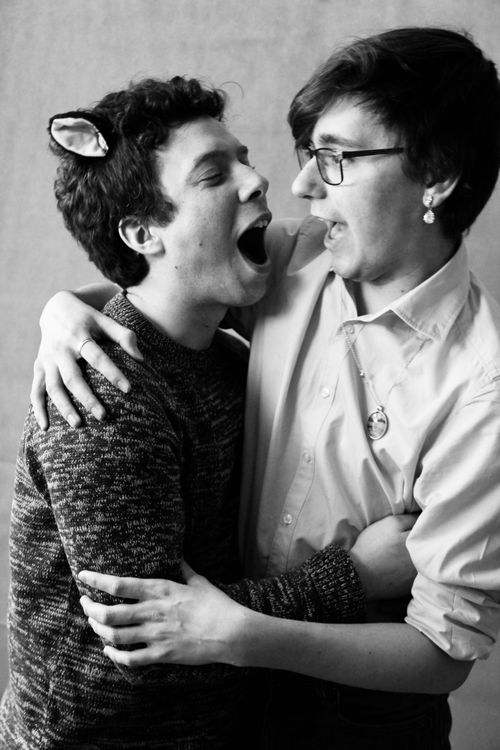 Free Two friends share a humorous embrace, expressing joy and warmth in black and white. Stock Photo