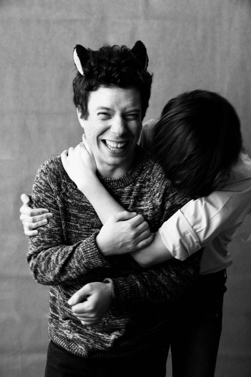 Free Two teenagers laughing together in a close embrace, capturing joyful friendship in black and white. Stock Photo