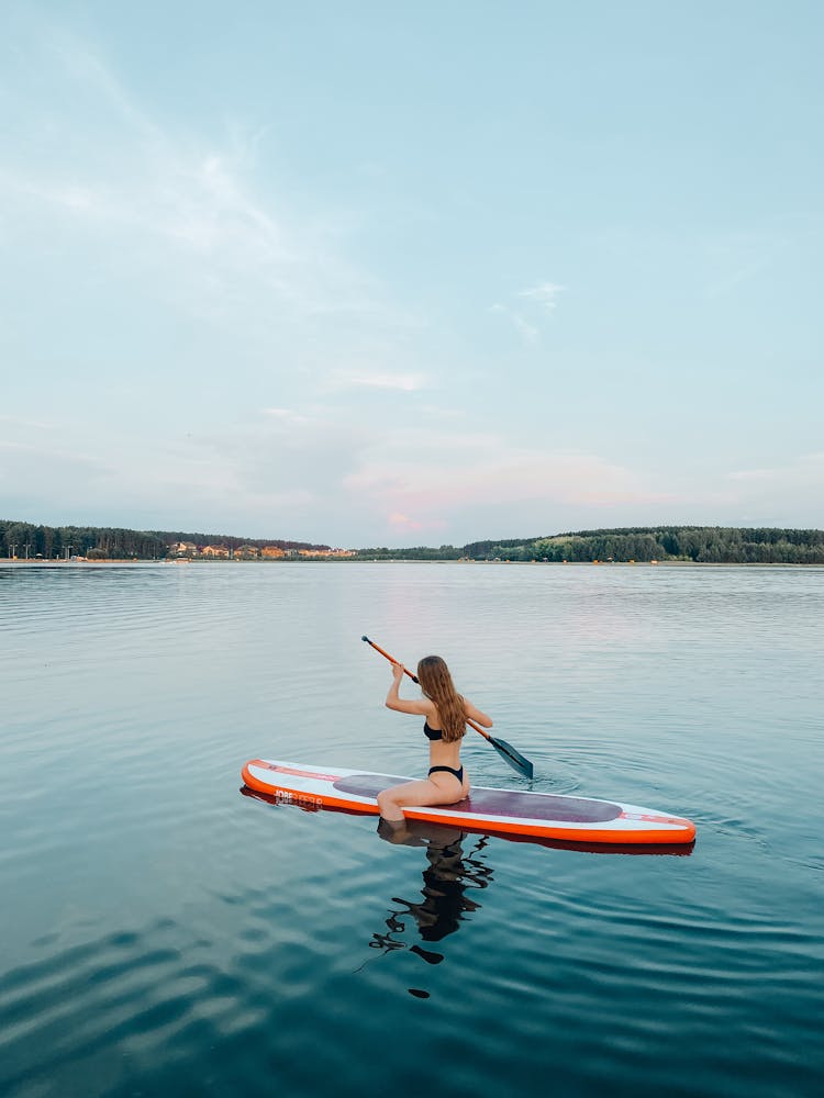 A Woman Paddleboarding