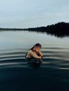 Woman in Black Bikini Top on Water