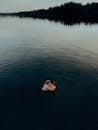 Woman in Black and White Bikini on Water