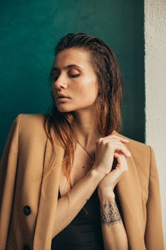 Stylish portrait of a woman with a brown blazer and nose piercing, capturing elegance and modern fashion.