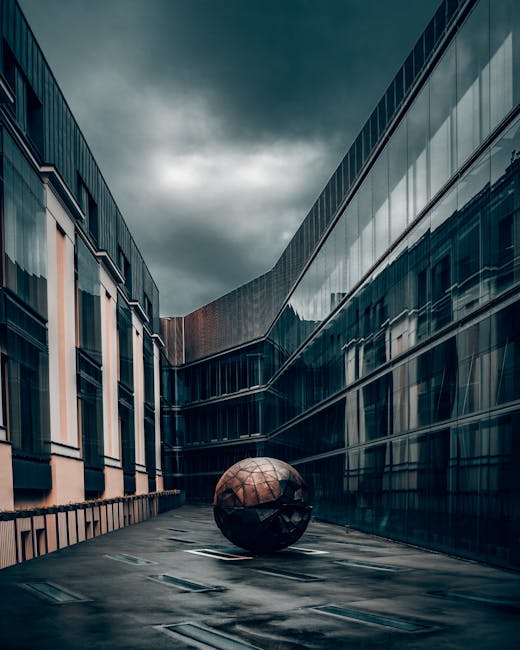 Brown and Black Ball on Gray Concrete Floor Near Brown Concrete Building