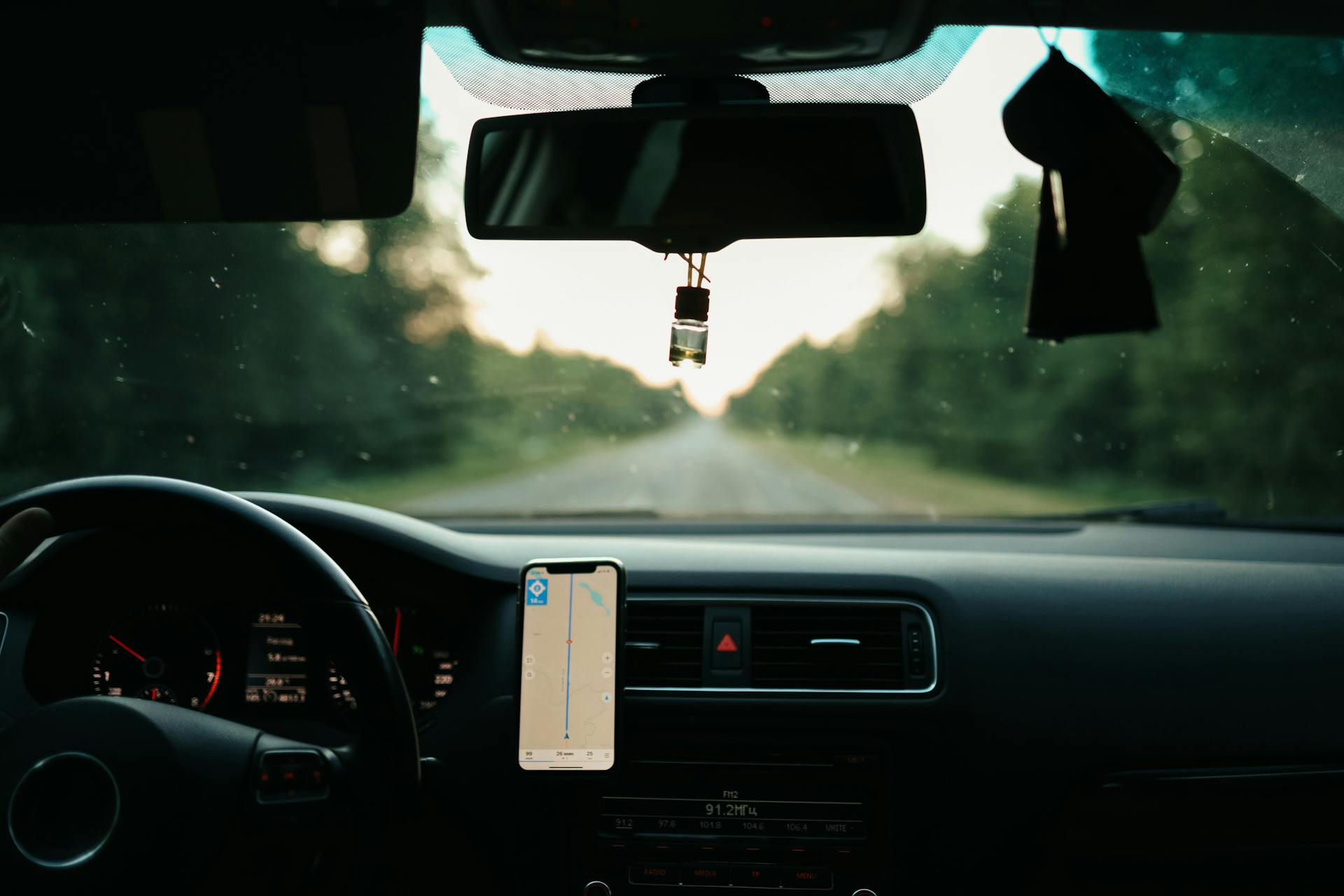 A Cellphone on a Holder Inside the Car
