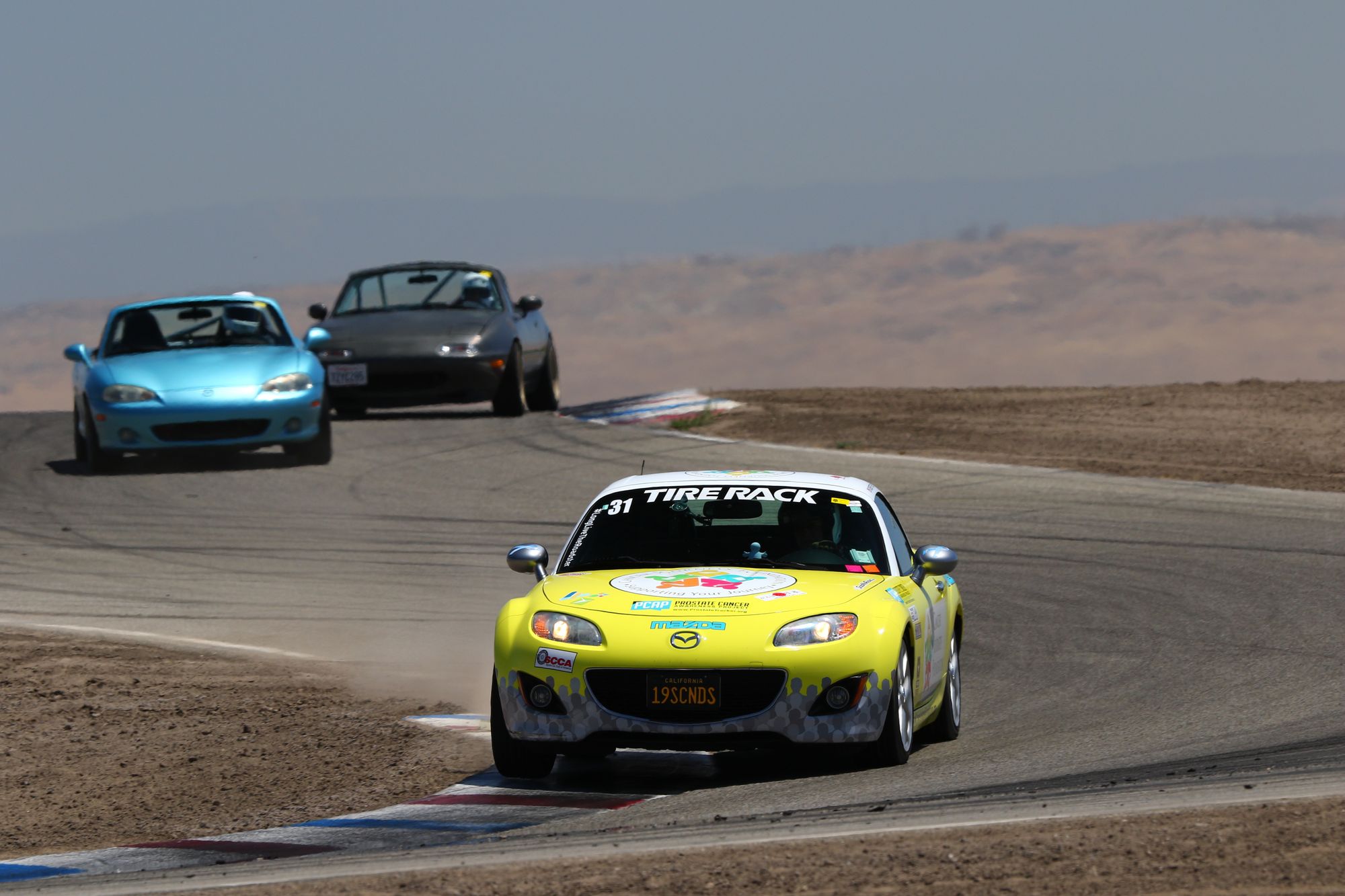 Shows Mazda MX-5 Miata sports cars in action, directly relevant to the MX-5 focus of this section.