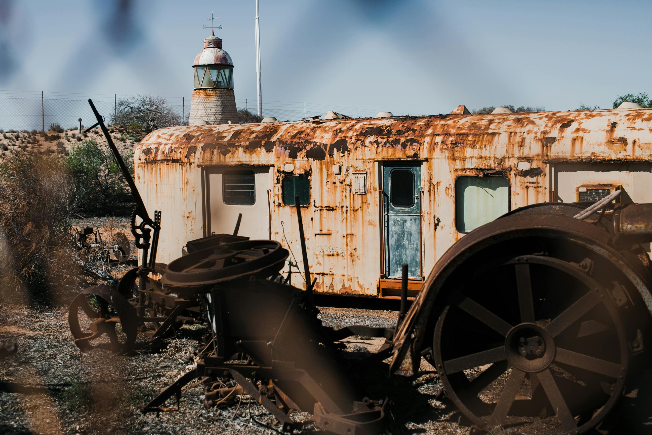 abandoned rusty wagon and old wheels