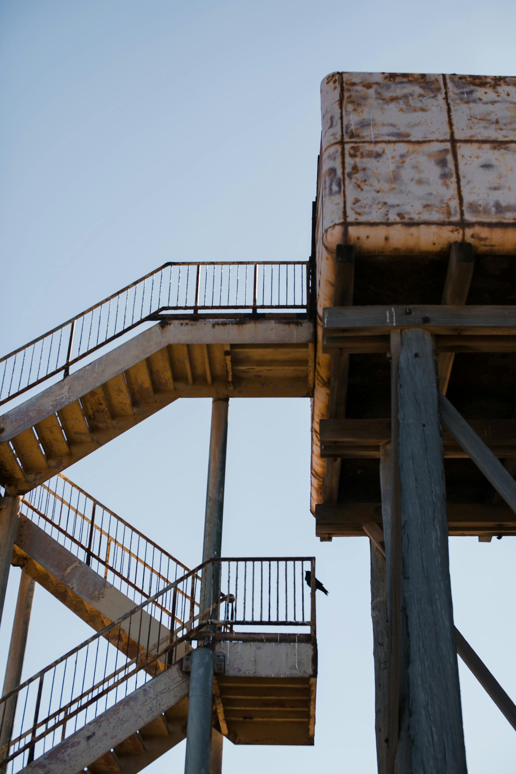 steel tower with stairway of abandoned building