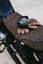 Motorbike with gloves parked on road