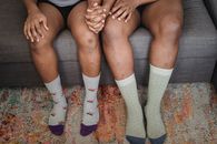 Person Wearing White and Purple Socks
