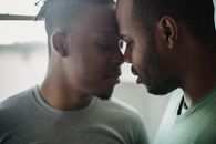 Man in White Crew Neck Shirt Kissing Womans Cheek