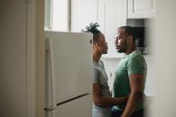 Couple Standing Together in Kitchen