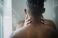 Two Men Touching in a Shower