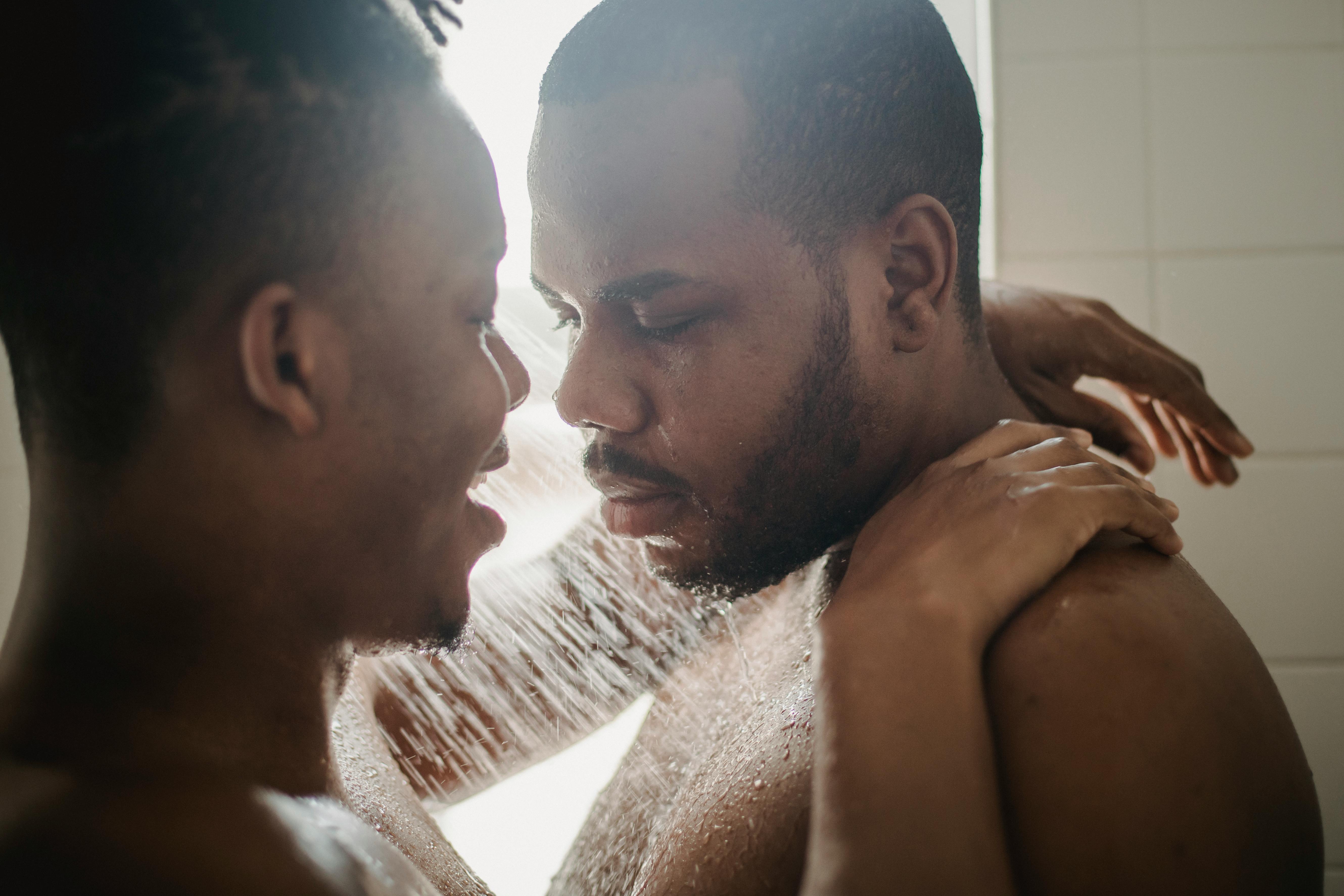 men taking a shower together