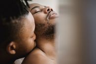 Man Lying on White Bed