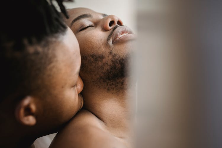 Close Up Of Man Kissing Partner In Neck