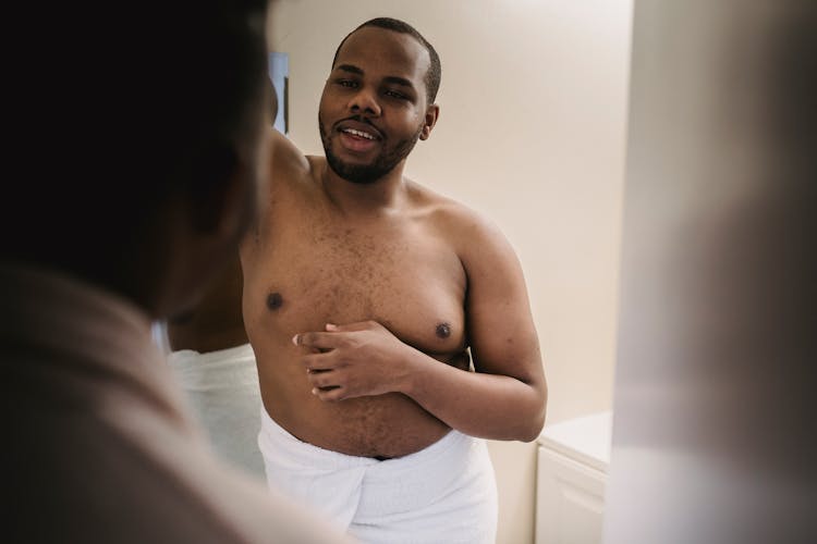 Two Men Talking In A Bathroom