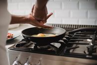 Person Cooking on Black Frying Pan