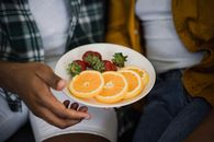 Sliced Orange Fruit on White Ceramic Plate