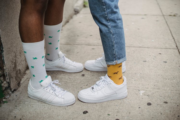 Close-up On Men Legs And Feet In Funny Socks 