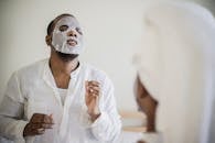 Man in White Dress Shirt With White Face Mask