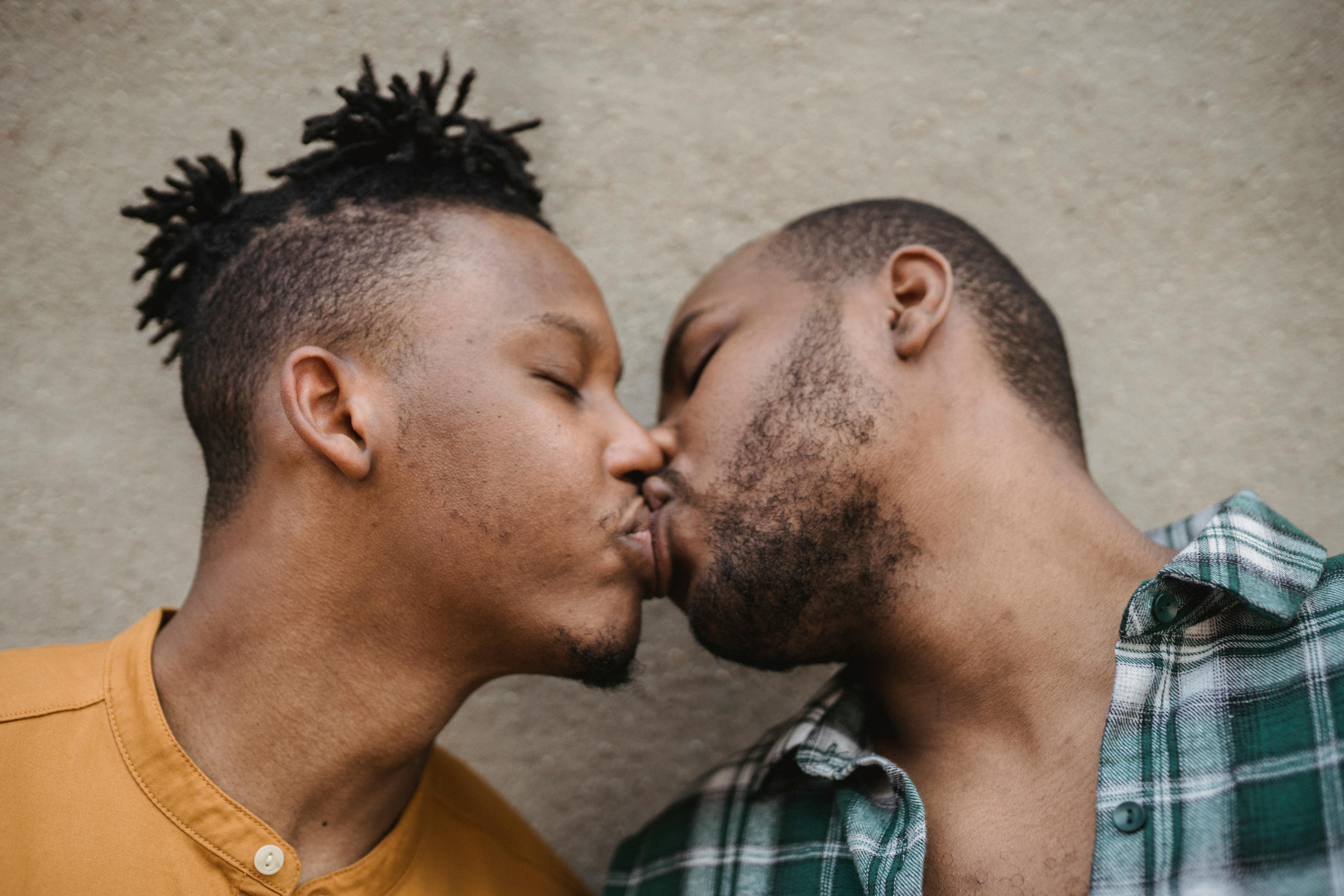 gay men kissing up close