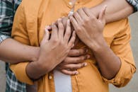 Close-up of Men Hugging 