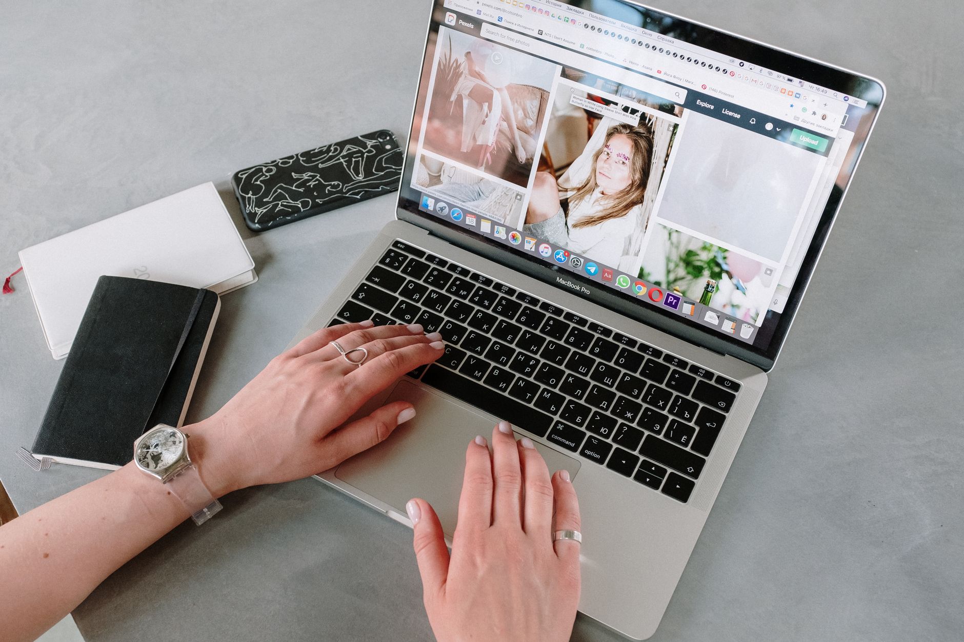 Person Using Macbook Pro on Table