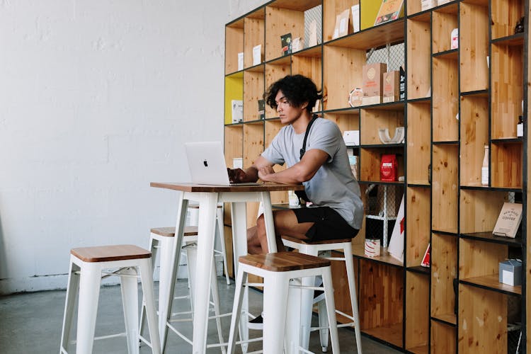 Man In Gray T-shirt Using Macbook