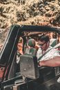 Man in White Shirt Driving Car