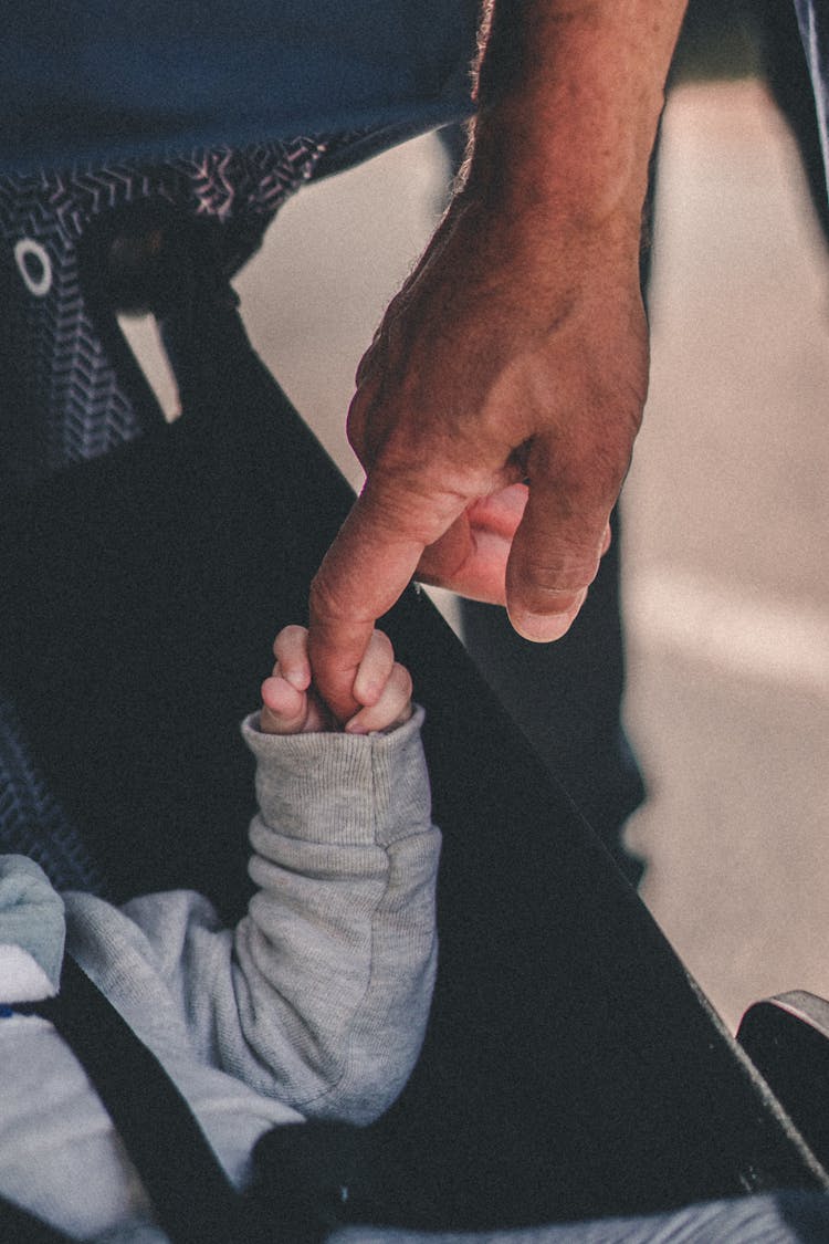 Baby Hand Holding Male Hand