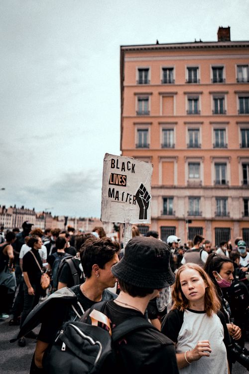 Free Crowd gathered in Lyon, France for Black Lives Matter protest, holding signs and demanding justice. Stock Photo