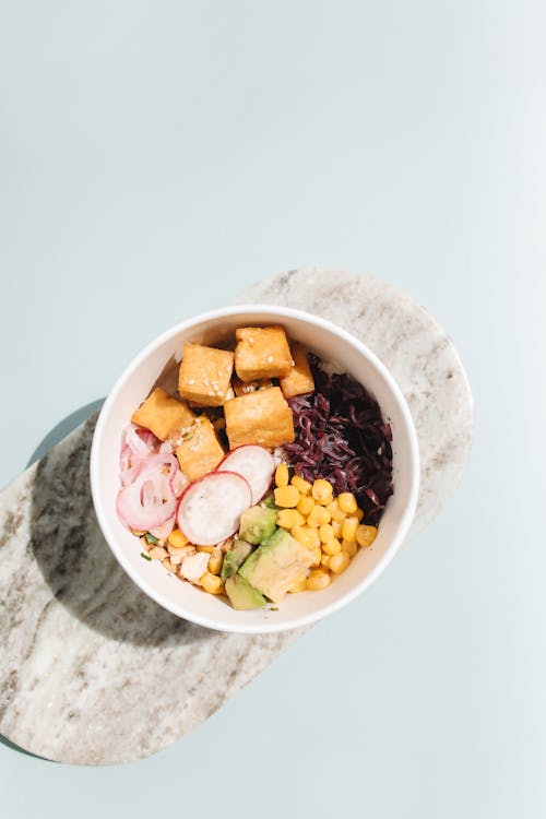 Free Delicious Poke Bowl on Marble Surface  Stock Photo