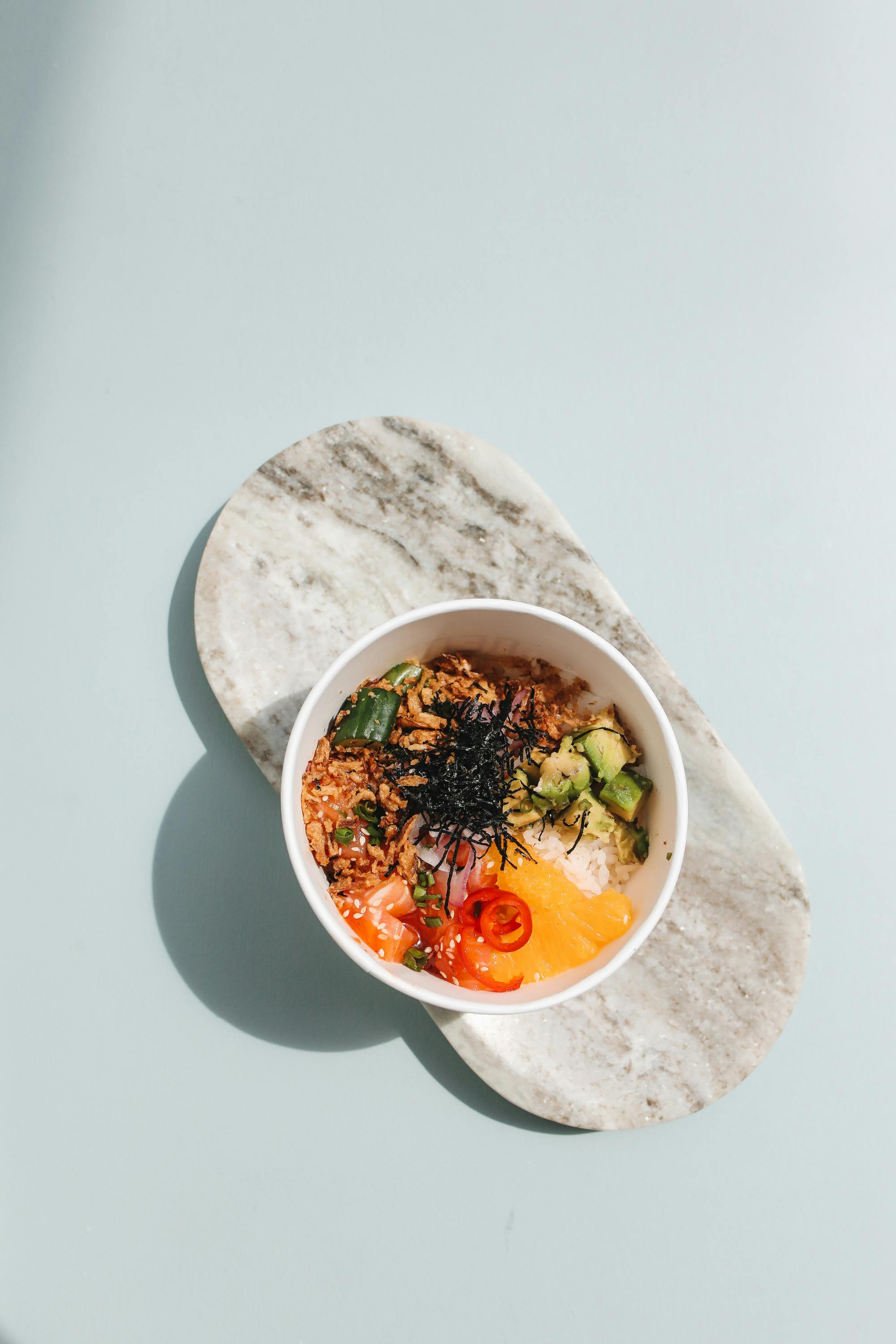 overhead shot of a poke bowl with seaweed