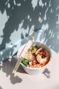 Photo of a Poke Bowl on a White Surface