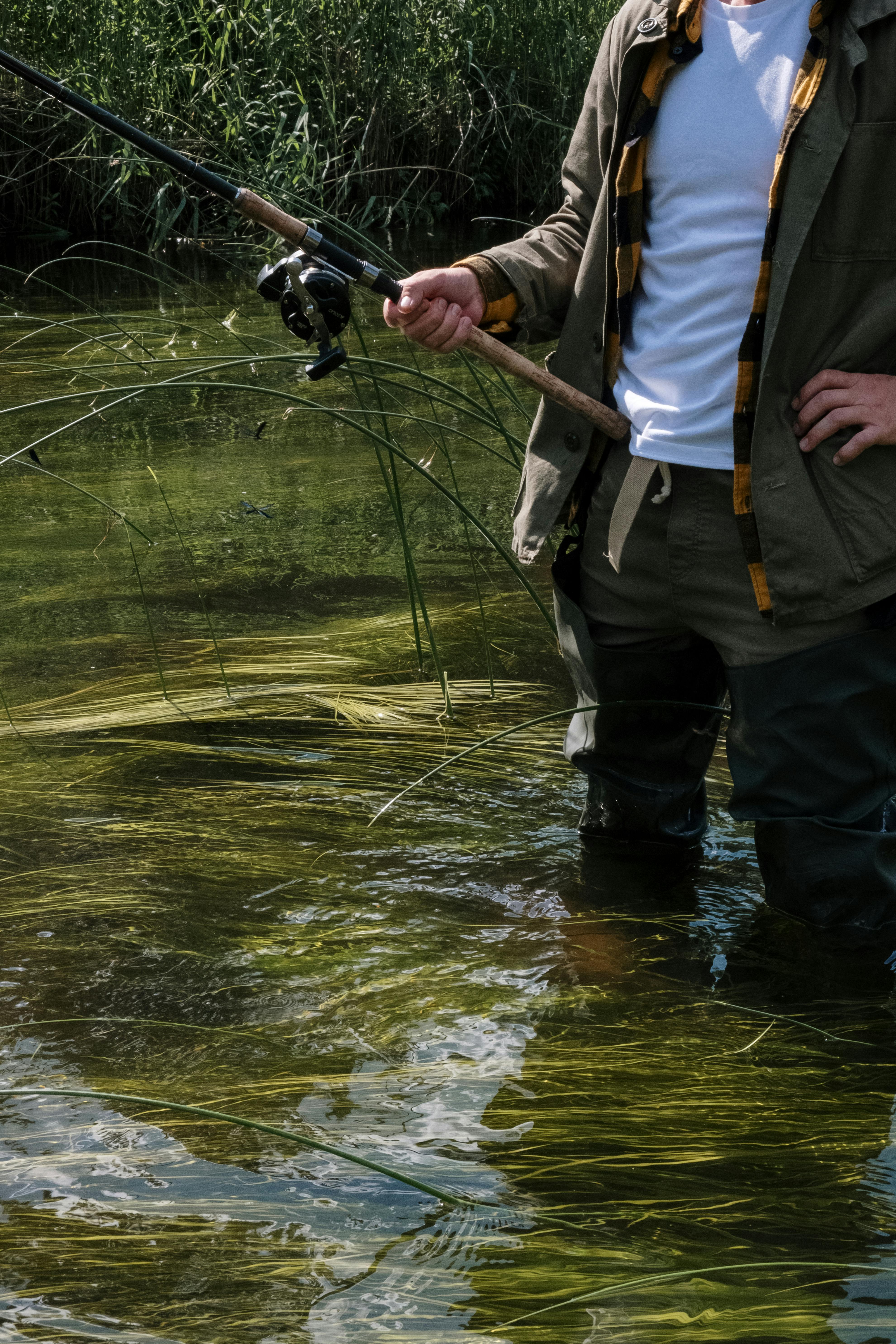 Person Holding Fishing Rod · Free Stock Photo