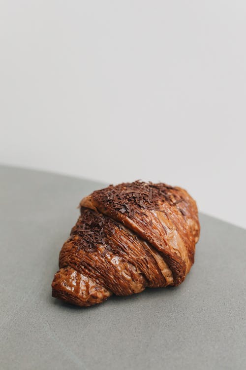 Free Photo of a Chocolate Croissant on a Gray Surface Stock Photo