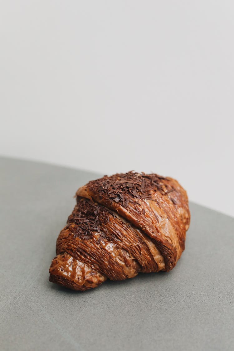 Photo Of A Chocolate Croissant On A Gray Surface