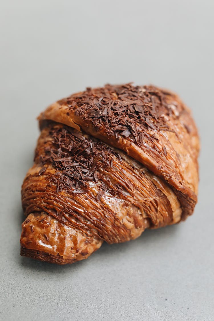 A Chocolate Croissant In Close-Up Photography